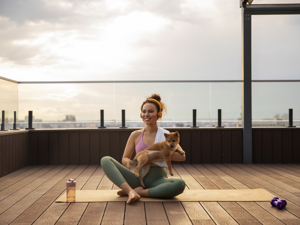 full shot woman doing sport with dog